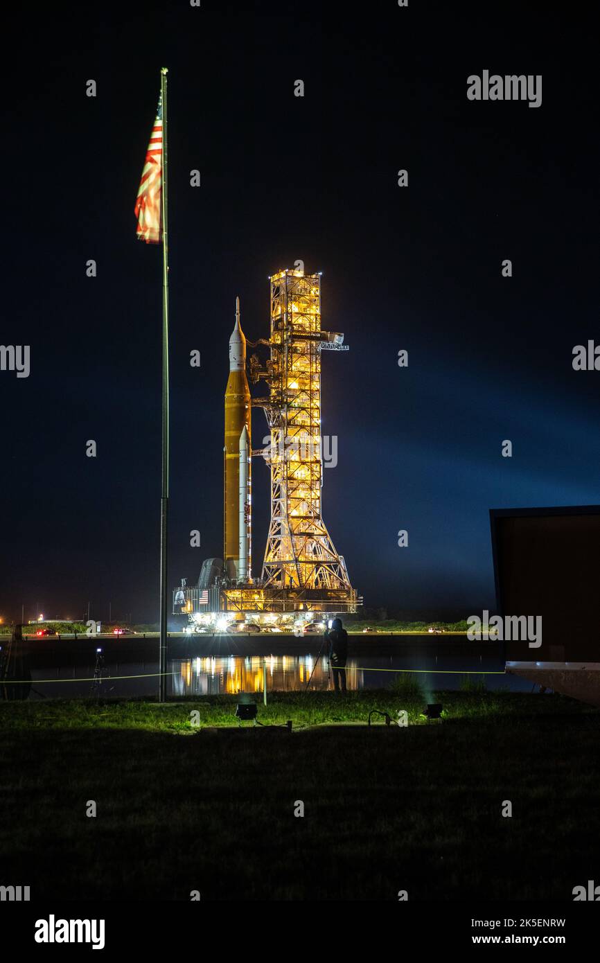 Artemis I Moon rocket rolls past the NASA News Center countdown clock