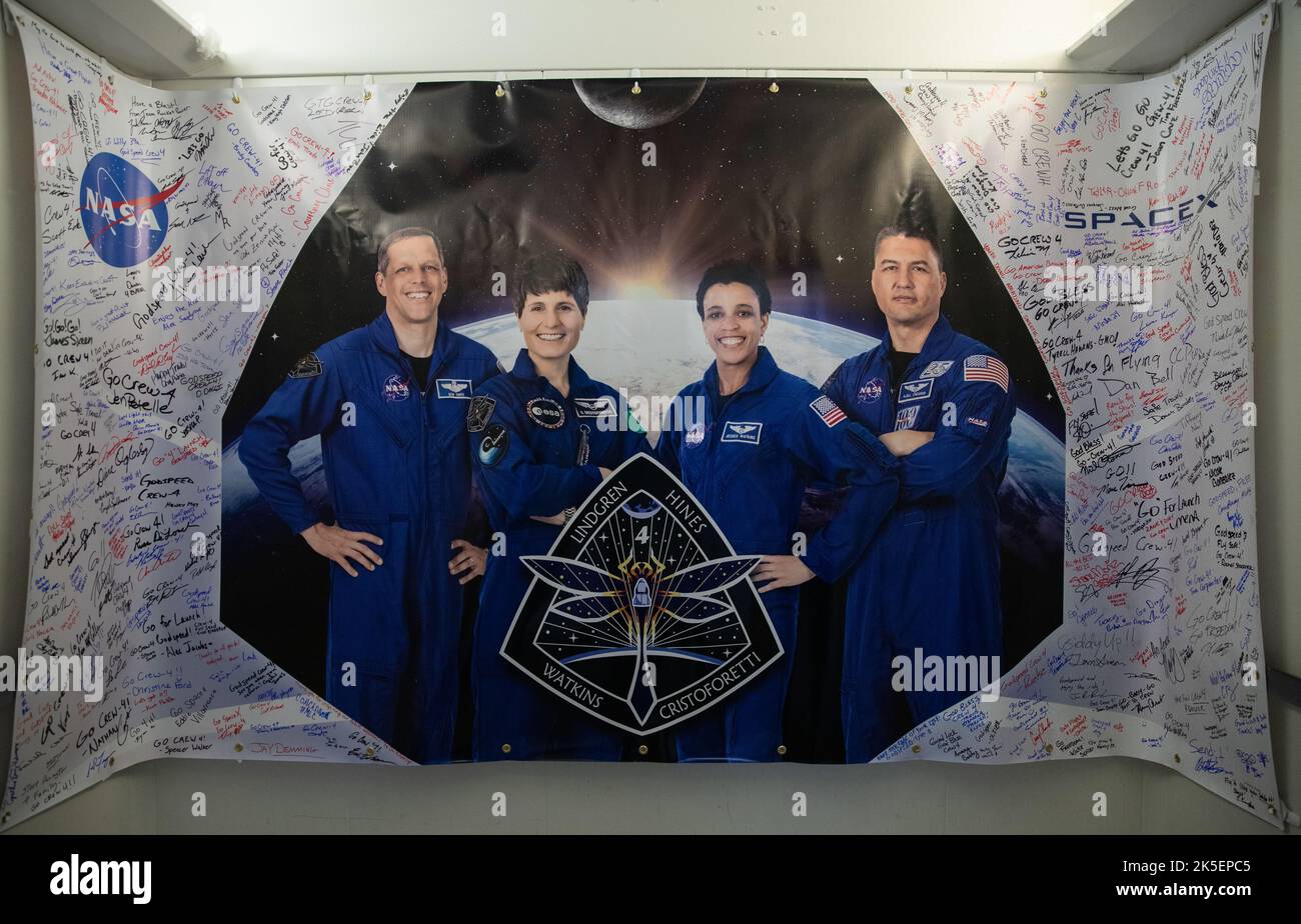 A poster depicting Crew-4 mission astronauts, from left, Bob Hines, Samantha Cristoforetti, Jessica Watkins, and Kjell Lindgren is shown in the Astronaut Crew Quarters inside Kennedy Space Center’s Neil A. Armstrong Operations and Checkout Building on April 27, 2022. The four astronauts will launch aboard SpaceX’s Crew Dragon – powered by the company’s Falcon 9 rocket – to the International Space Station as part of NASA’s Commercial Crew Program. They are scheduled to lift off today at 3:52 a.m. EDT from Launch Complex 39A at Kennedy. Stock Photo
