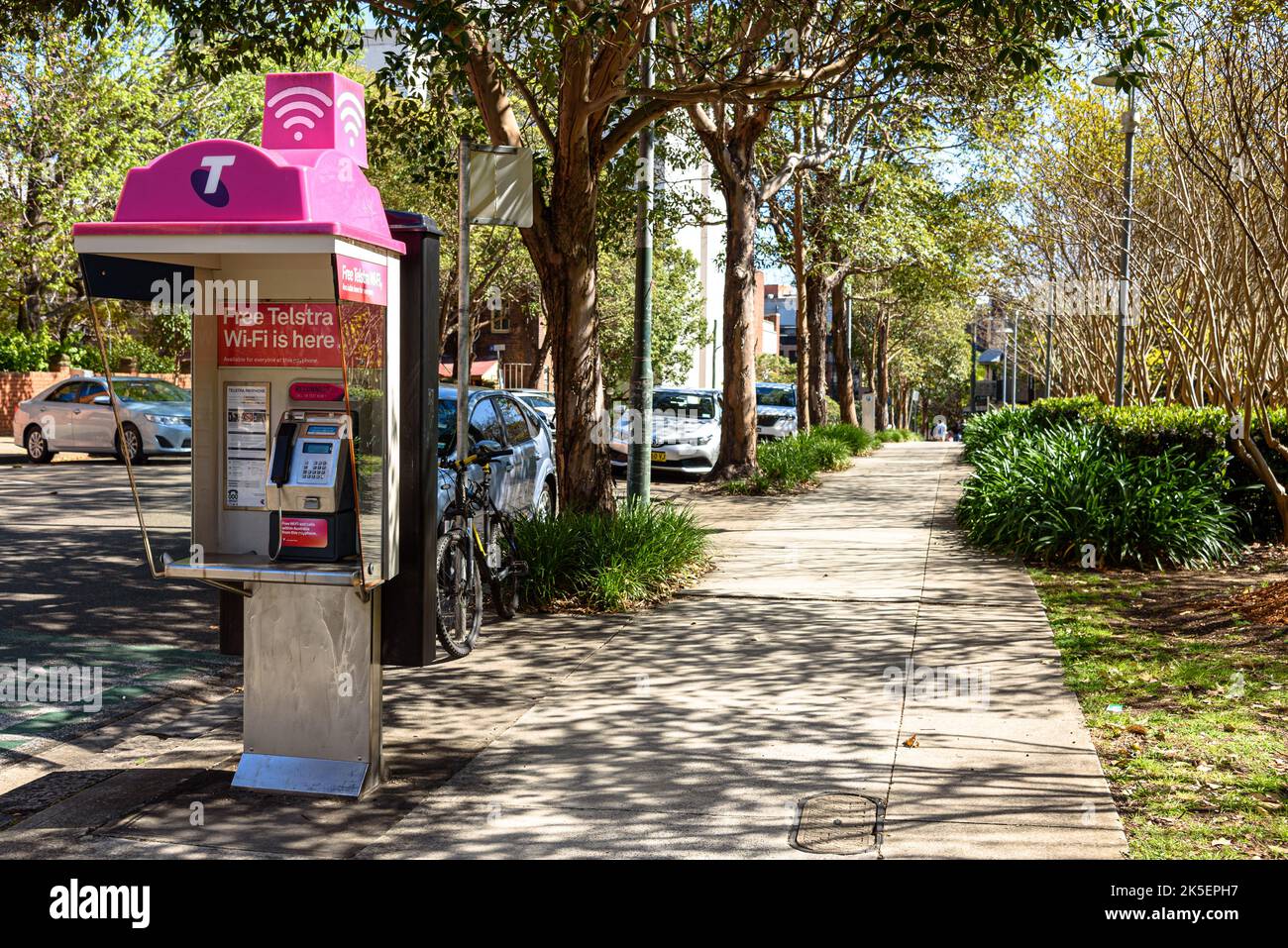 A Telstra public payphone on a sidewalk in Ultimo, Sydney, New South Wales Stock Photo