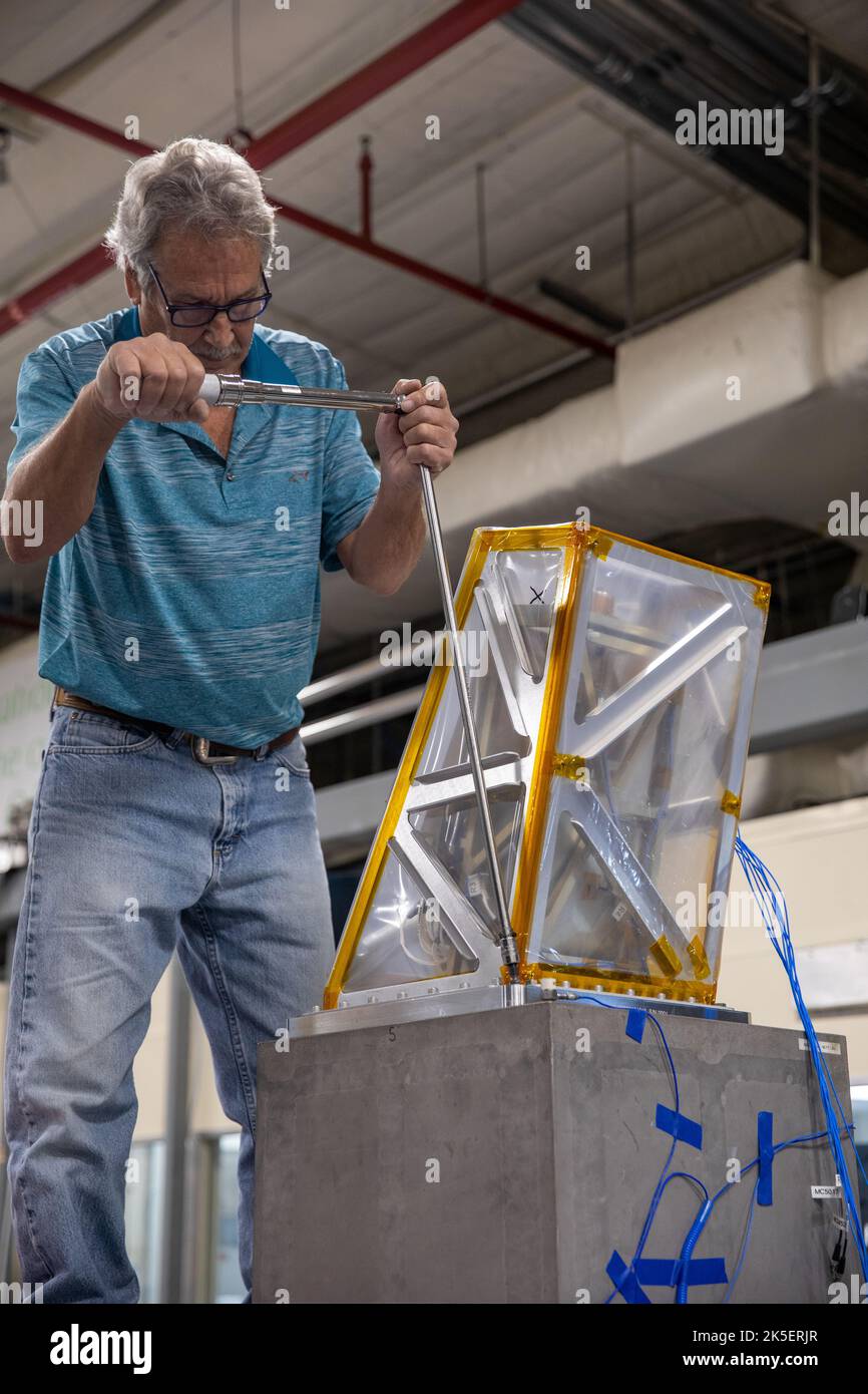 A Kennedy Space Center engineer prepares the Mass Spectrometer observing lunar operations (MSolo) instrument for vibration testing inside the Florida spaceport’s Cryogenics Laboratory on Aug. 3, 2022. MSolo is a commercial off-the-shelf mass spectrometer modified to work in space and will help analyze the chemical makeup of landing sites on the Moon, as well as study water on the lunar surface. Researchers and engineers are preparing MSolo instruments to launch on four robotic missions as part of NASA’s Commercial Lunar Payload Services – commercial deliveries beginning in 2023 that will perfo Stock Photo