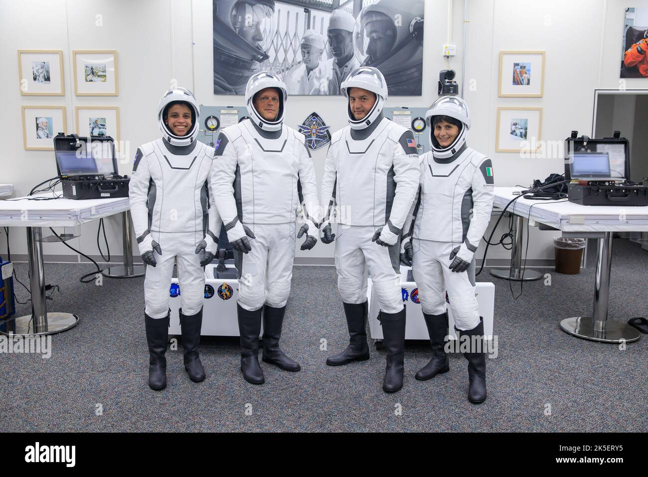 Crew-4 mission astronauts participate in NASA’s SpaceX Crew-4 dry dress rehearsal in the suit room inside Kennedy Space Center’s Neil A. Armstrong Operations and Checkout Building on April 20, 2022. A team of SpaceX suit technicians assisted them as they put on their custom-fitted spacesuits and checked the suits for leaks. From left are: Jessica Watkins, mission specialist; Bob Hines, pilot; Kjell Lindgren, commander; and Samantha Cristoforetti, mission specialist. SpaceX’s Falcon 9 rocket and Crew Dragon, named Freedom by the Crew-4 crew, will launch the astronauts to the International Space Stock Photo