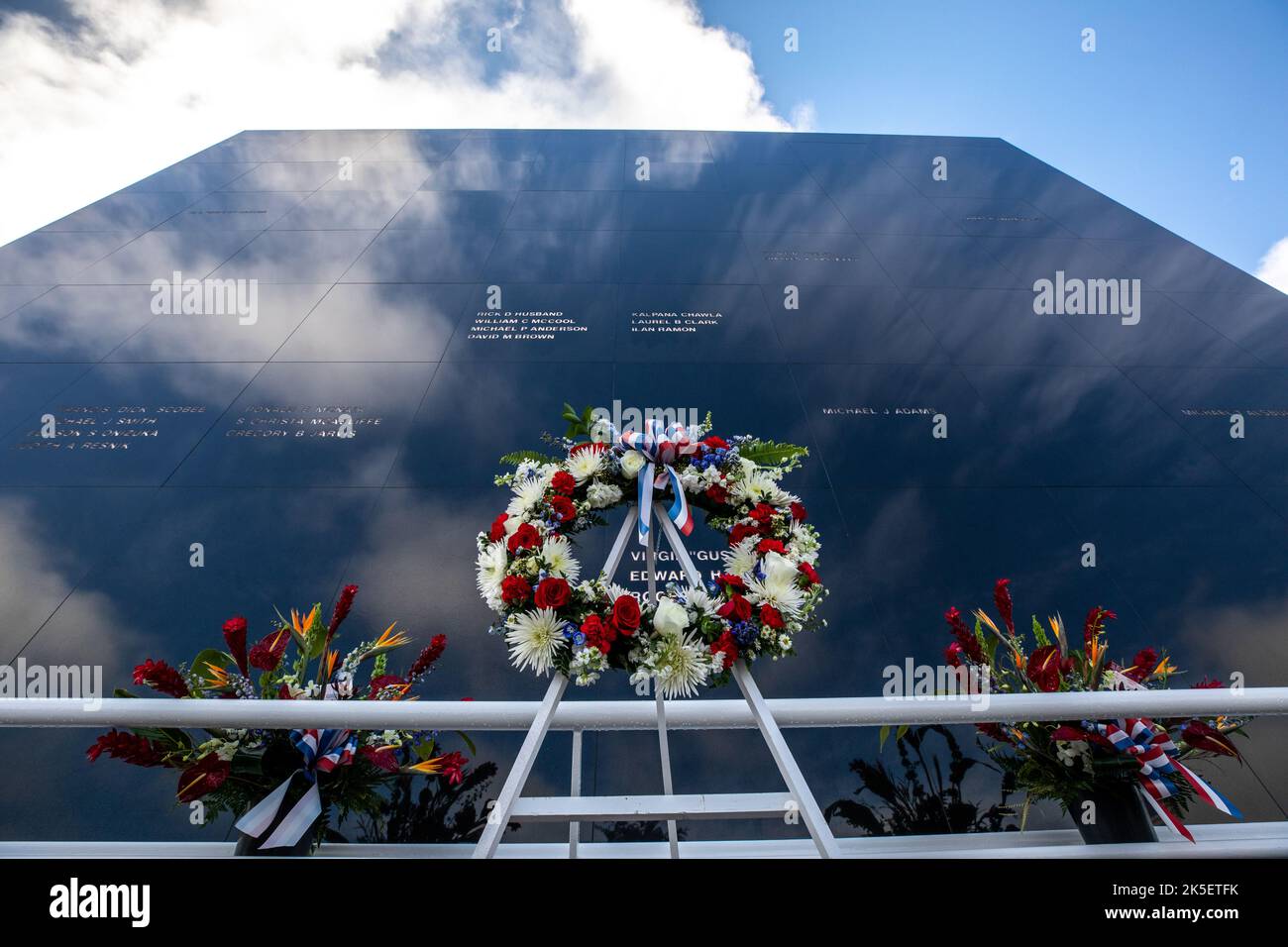 A wreath is placed in front of the Space Mirror Memorial at NASA’s Kennedy Space Center Visitor Complex during the NASA Day of Remembrance on Jan. 27, 2022. Kennedy Space Center in Florida paid tribute to the crews of Apollo 1 and space shuttles Challenger and Columbia, as well as other astronauts who lost their lives while furthering the cause of exploration and discovery. Stock Photo