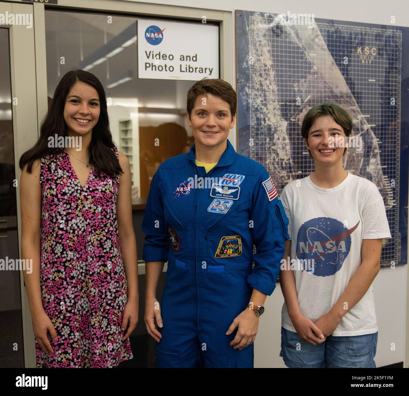 Student essay winners Amanda Gutierrez, left, and Taia Saurer pose with NASA astronaut Anne McClain at the agency’s news center at Kennedy Space Center in Florida on Sept. 2, 2022. Gutierrez and Saurer won the Artemis Moon Pod Essay Contest – a nationwide event involving nearly 14,000 students – for their creative visions of a pioneering journey to the Moon. The grand prize was a trip to Kennedy to watch the launch of Artemis I. Gutierrez, 17, is an 11th-grader from Lincoln, Nebraska, while Saurer, 14, is an eighth-grader from Laguna Beach, California. Stock Photo