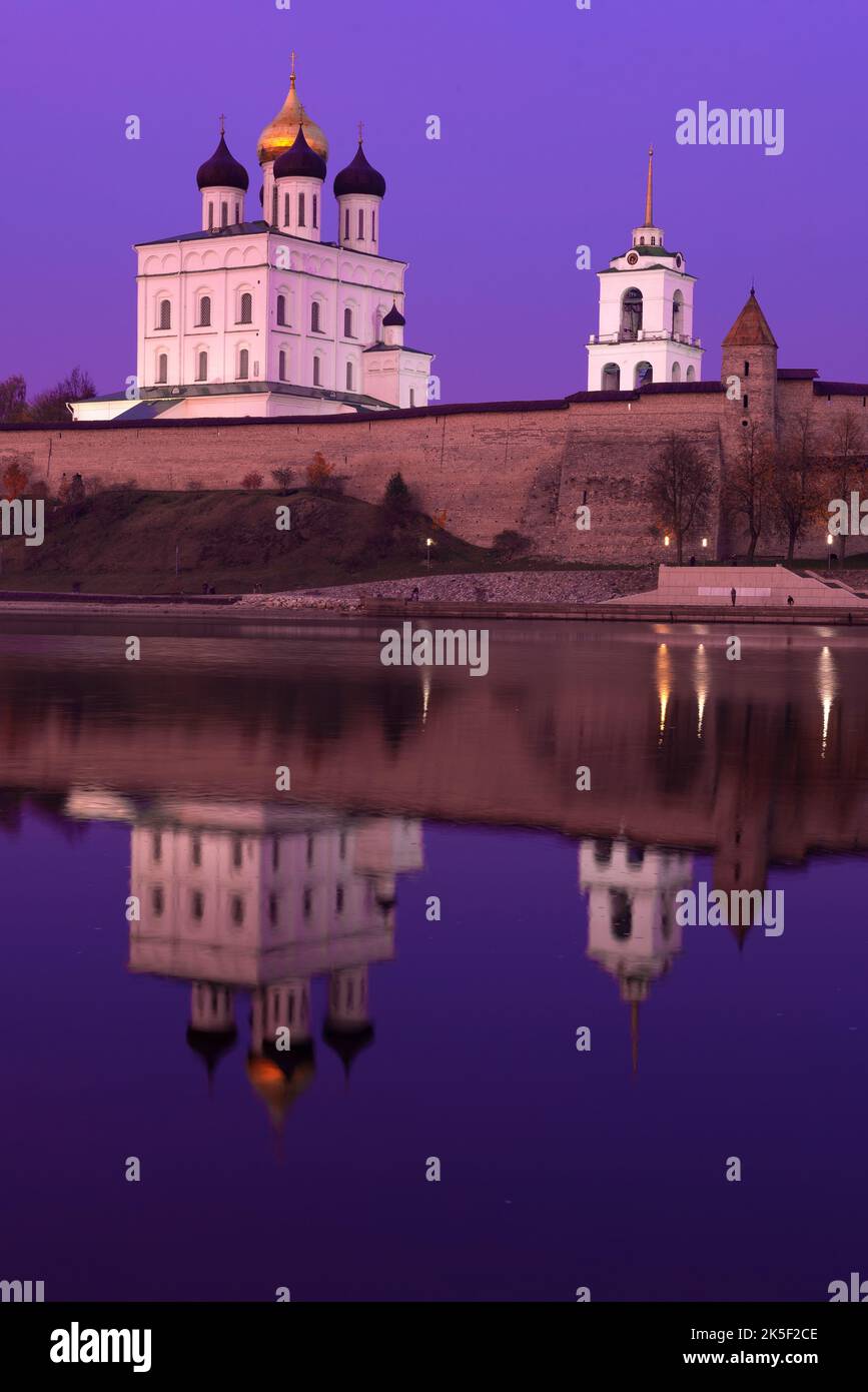 Ancient Trinity Cathedral with reflection in the lilac October twilight. Pskov, Russia Stock Photo