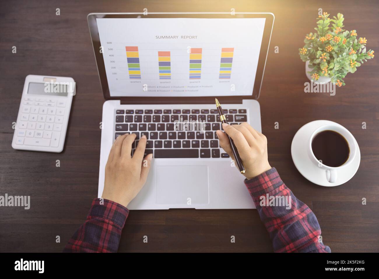 Young Businessman Analyzing Graph On Computer At Workplace Stock Photo