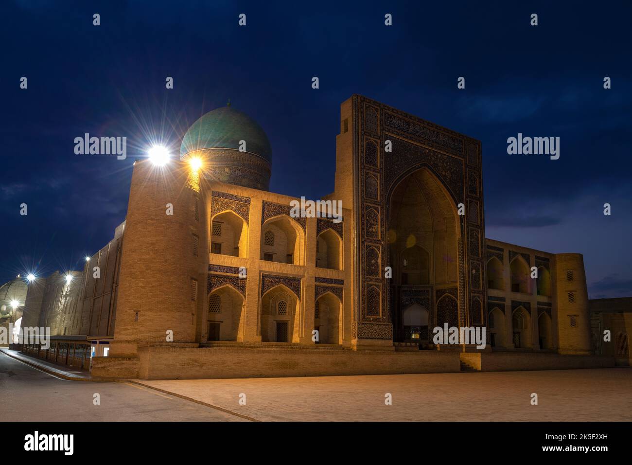 Medieval Mir-i-Arab madrasah (16th century) before dawn. Bukhara, Uzbekistan Stock Photo
