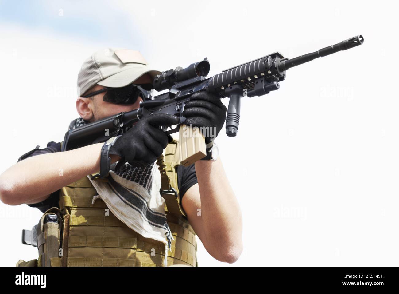 Hes got the enemy in his sights. a military sniper taking aim. Stock Photo