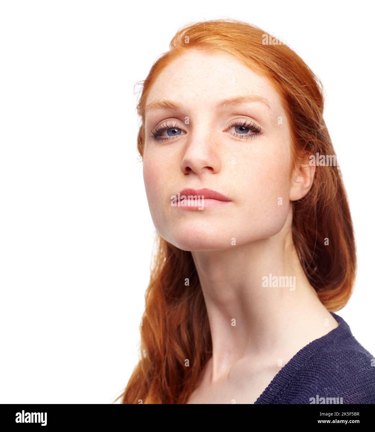 Nose in the air. Studio portrait of an attractive redhead isolated on white. Stock Photo