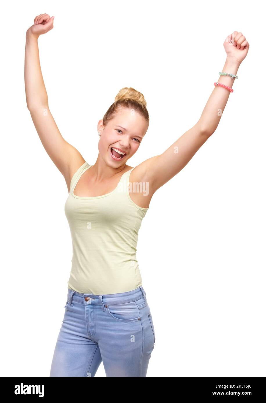 Feeling fantastic. A pretty smiling teenage girl standing with arms