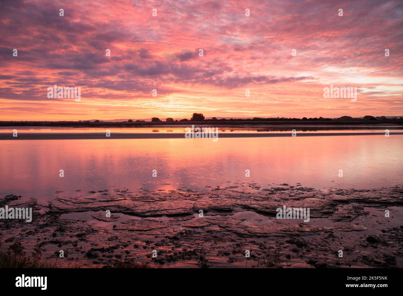 Sunrise over the river Severn at Newnham, Gloucestershire Stock Photo