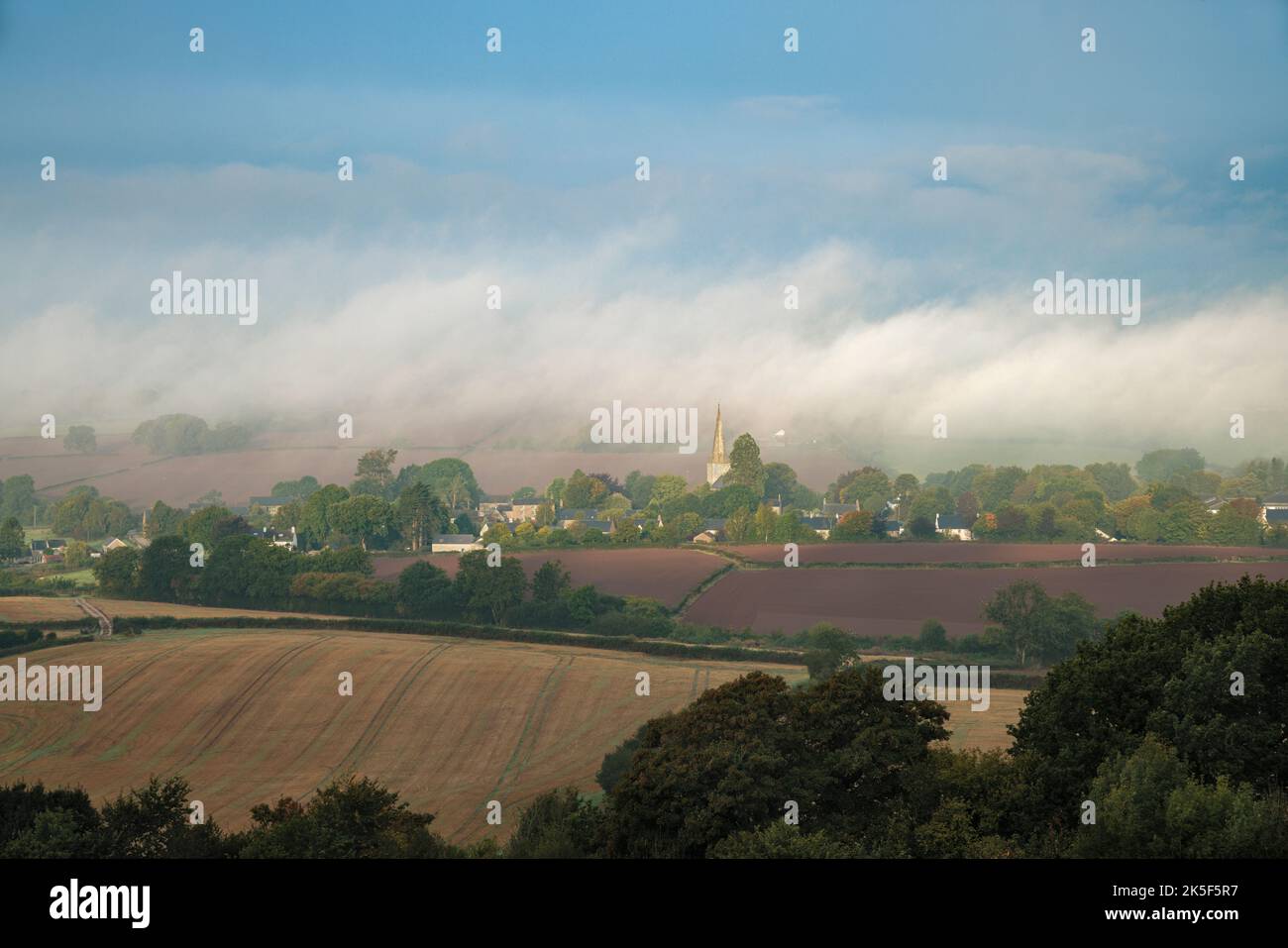 Morning mist over the village of Trellech, Wales. Stock Photo