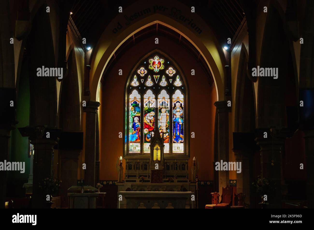 Stained glass window above the altar in Our Lady of the Rosary Catholic