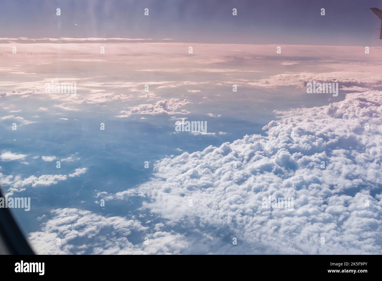 A landscape shot high above the airplane cloud. Stock Photo