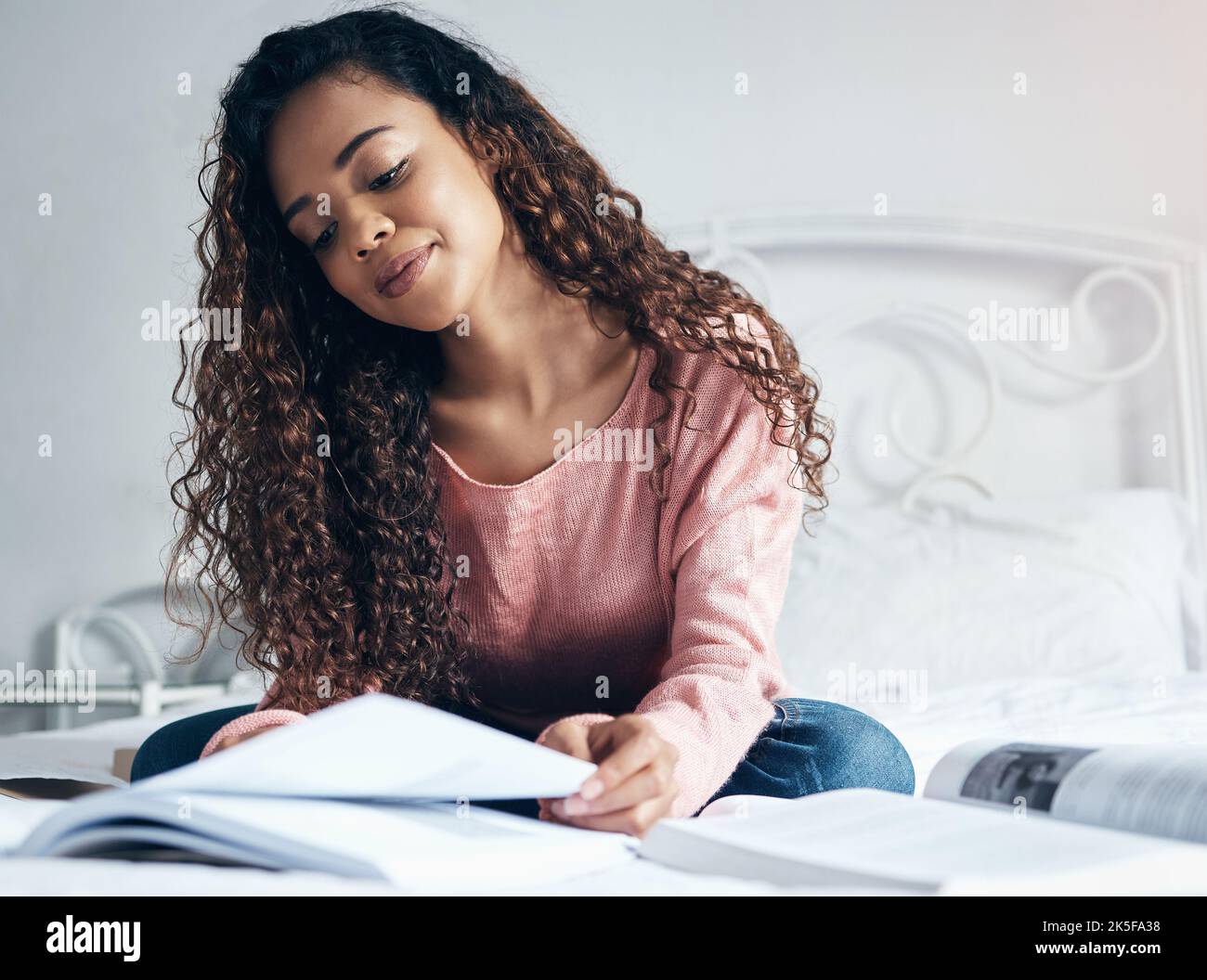Education, scholarship and study with a woman student planning and thinking about project with book in bed. Idea, thinking and notebook with Stock Photo