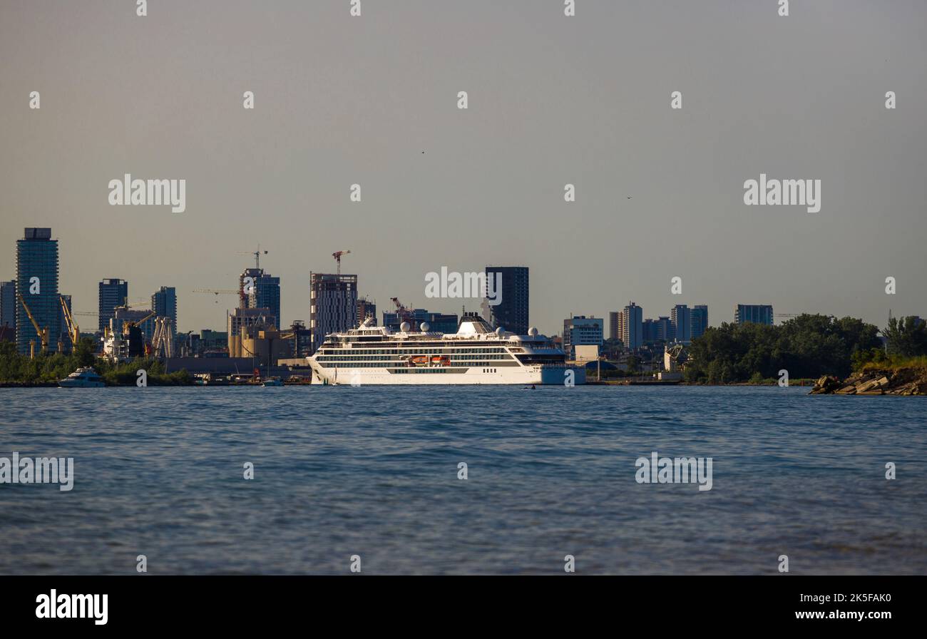 luxury cruise ship docks in port at sunset. Passenger vessel Sea traveling Stock Photo