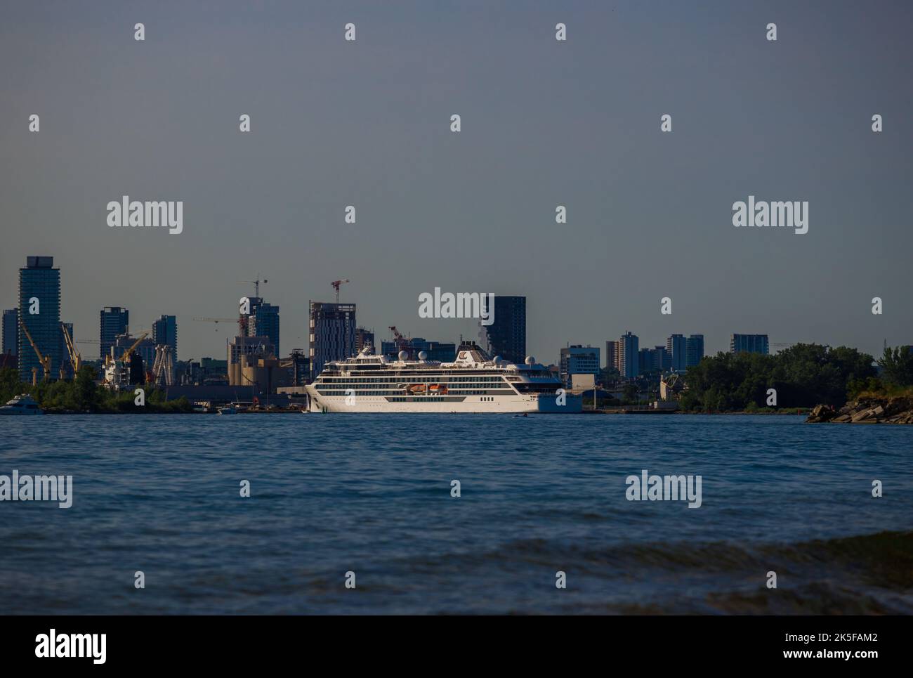 luxury cruise ship docks in port at sunset. Passenger vessel Sea traveling Stock Photo