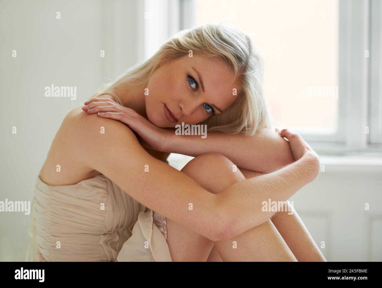 Embracing the morning. Portrait of an attractive woman sitting in her bedroom. Stock Photo