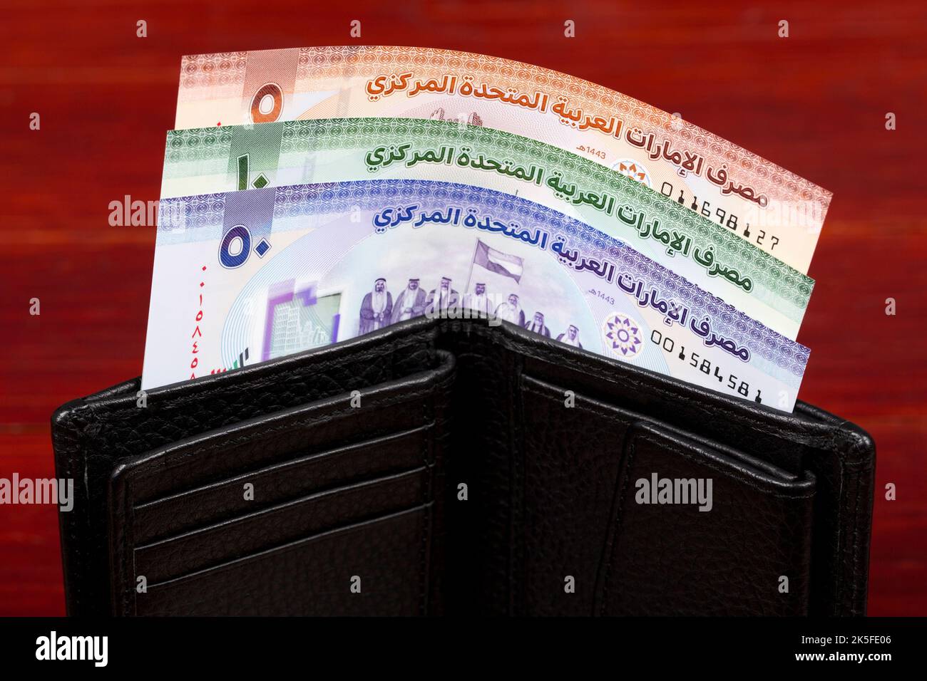 New series of money from the United Arab Emirates - Dirham in the black wallet Stock Photo