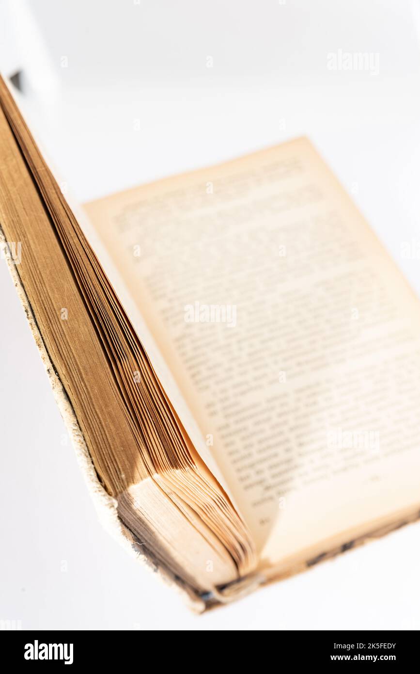 Old yellowed book isolated on a white background. Book with yellow