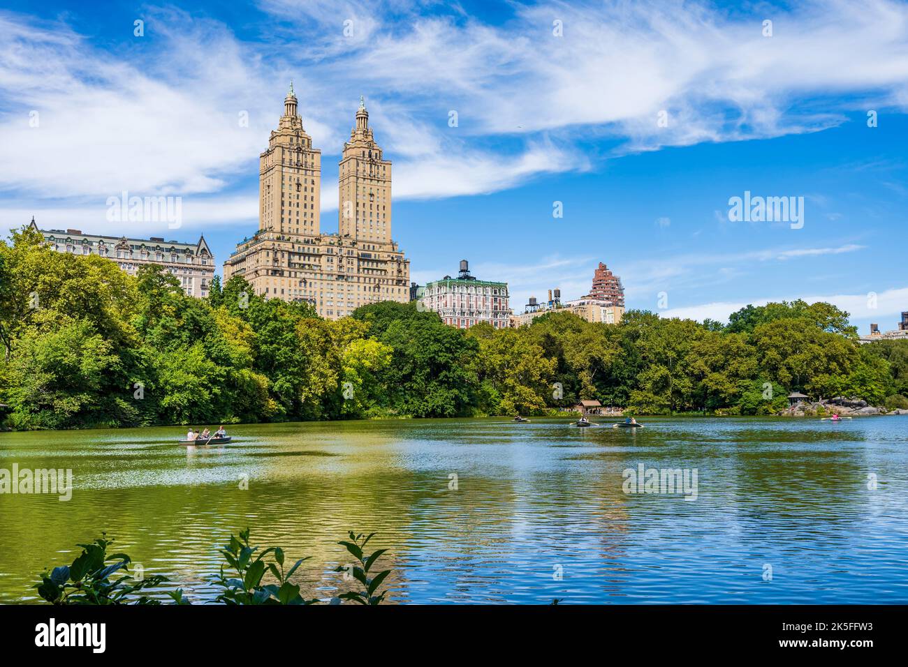 The Lake in Central Park with boat and The San Remo hotel in the