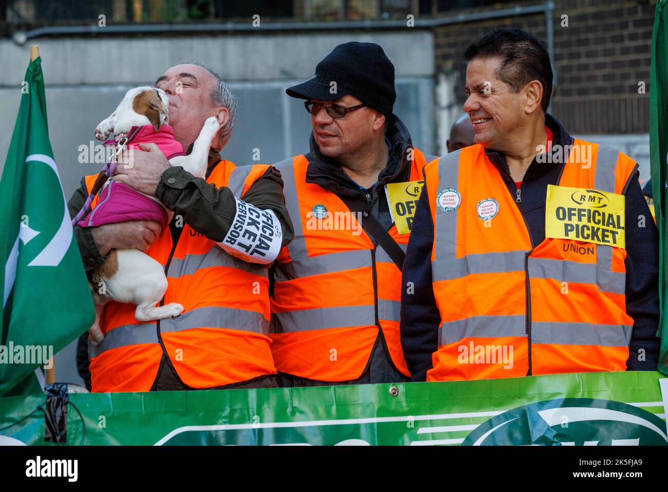 A dog licks the face of one of the pickets hires stock photography and