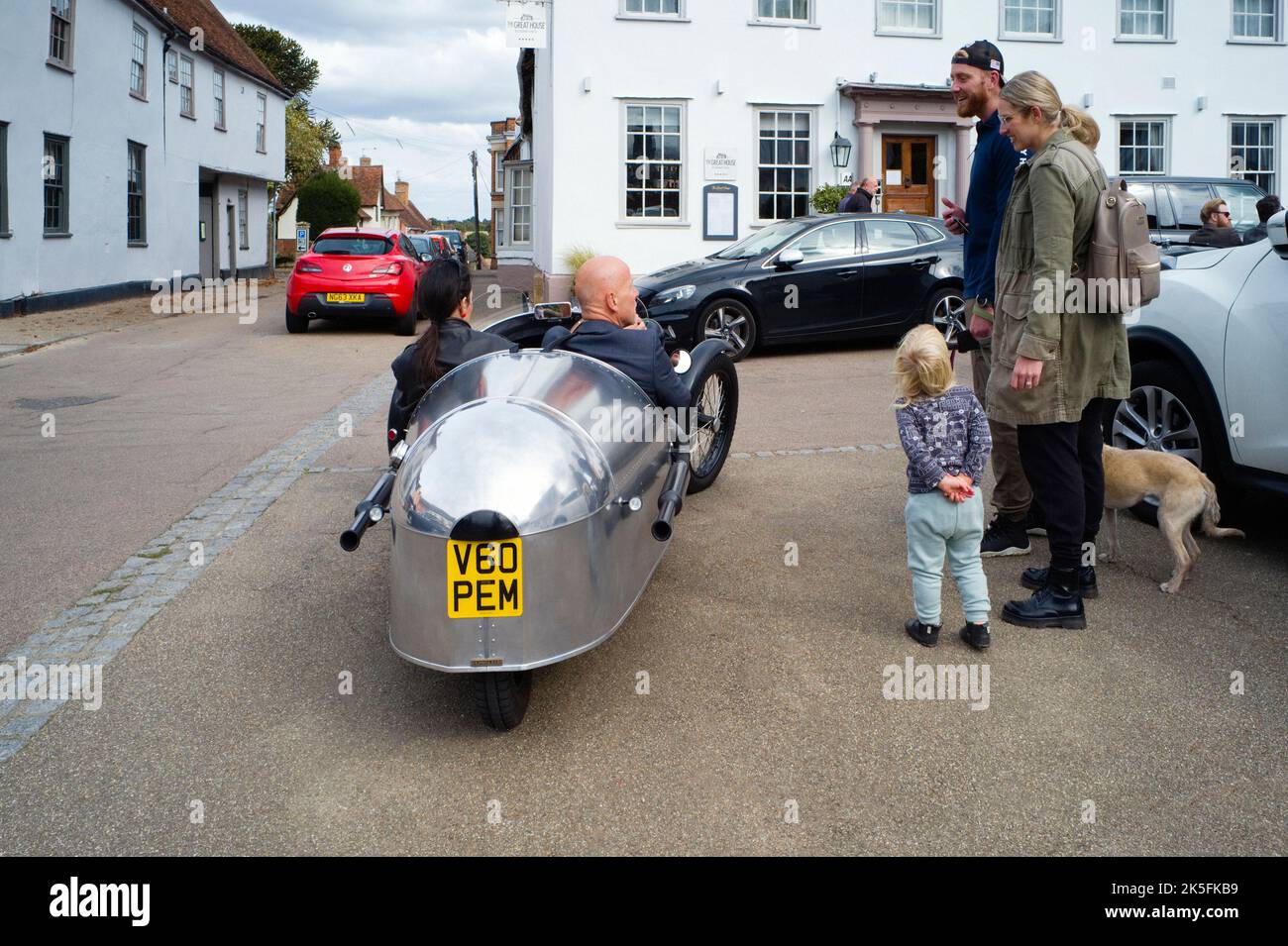 Morgan three wheeler car viewed from behind while at a rally in the centre of Lavenham, Suffolk Stock Photo