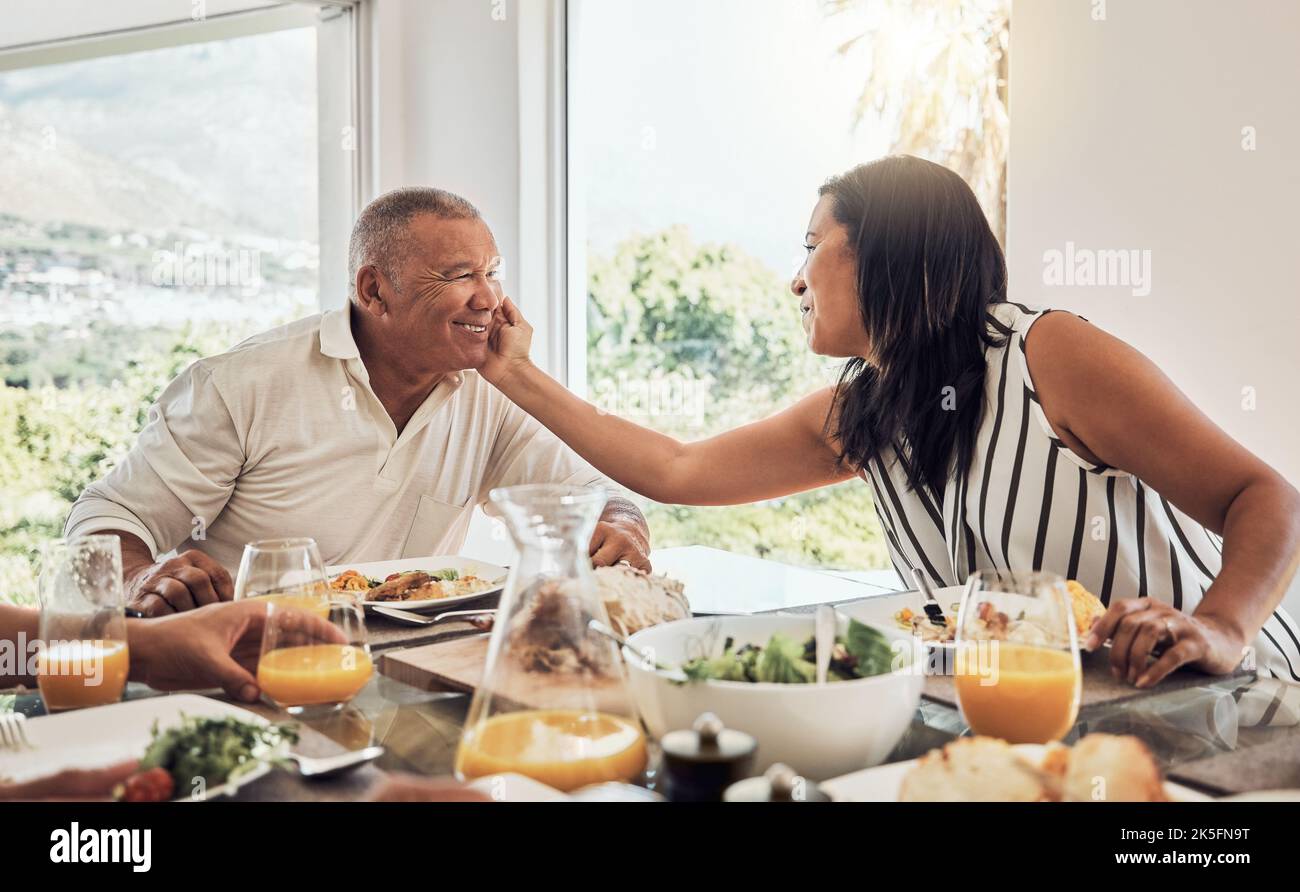 Senior couple, love bonding or food in house, home or restaurant in thanksgiving, marriage anniversary or celebration event. Smile, happy or Stock Photo