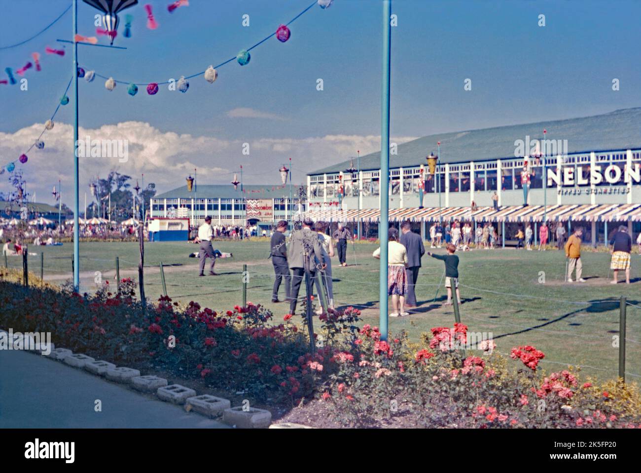 Action on the putting green on a sunny day at Butlin’s holiday camp in Bognor in 1964. The resort is on the south-coast at Bognor Regis, West Sussex, England, UK. Butlin's presence in the town began in 1932 with the opening of an amusement park; soon it expanded to take in a zoo. In 1960, Billy Butlin opened his first post-war mainland holiday camp here. The camp survived a series of cuts in the early 1980s, attracting further investment and again in the late 1990s when it was retained as one of only three camps still bearing the Butlin name – a vintage 1960s photograph. Stock Photo