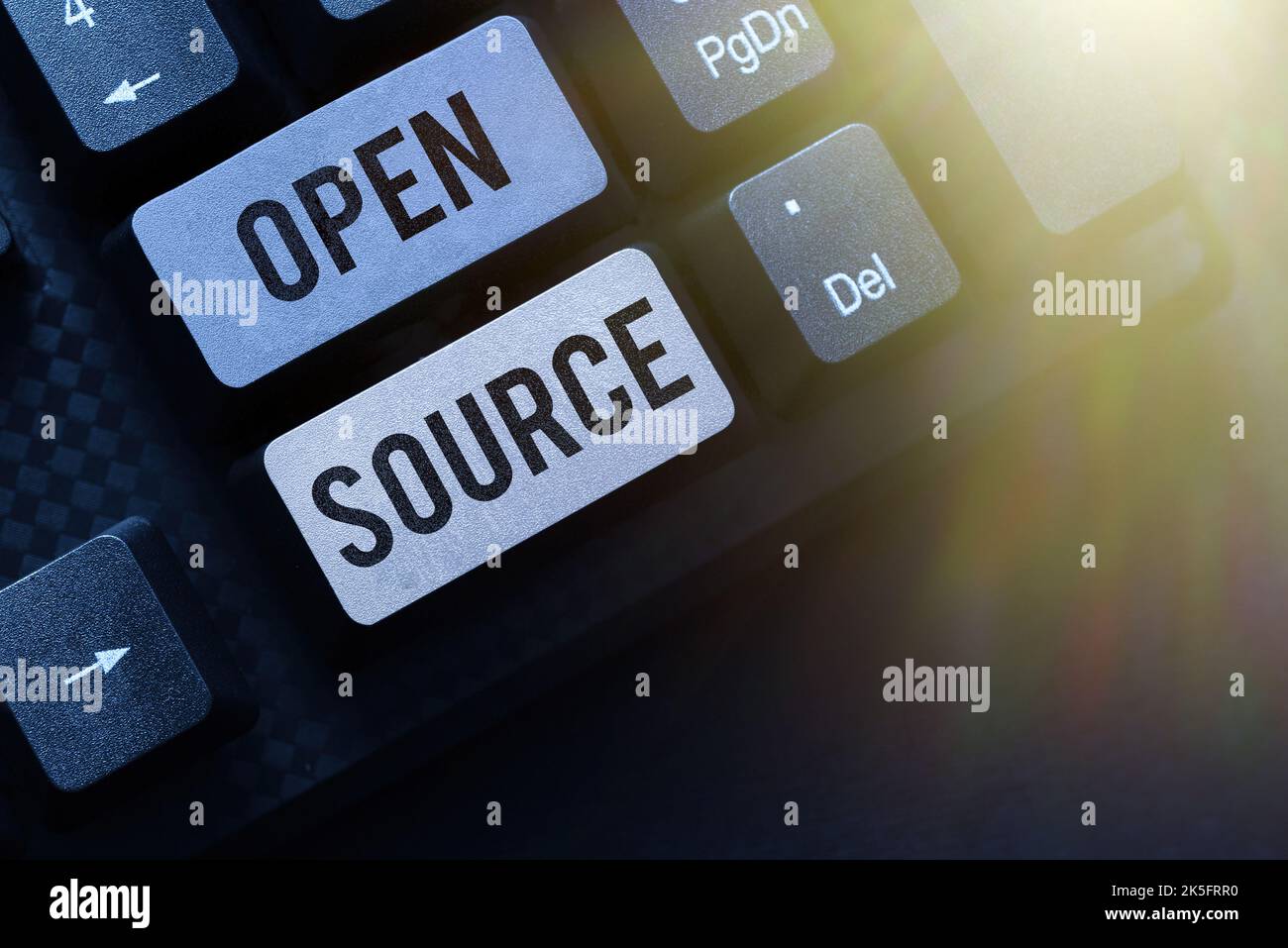 Sign displaying Open Source. Business overview contains the source code that can be modified and enhanced Stock Photo