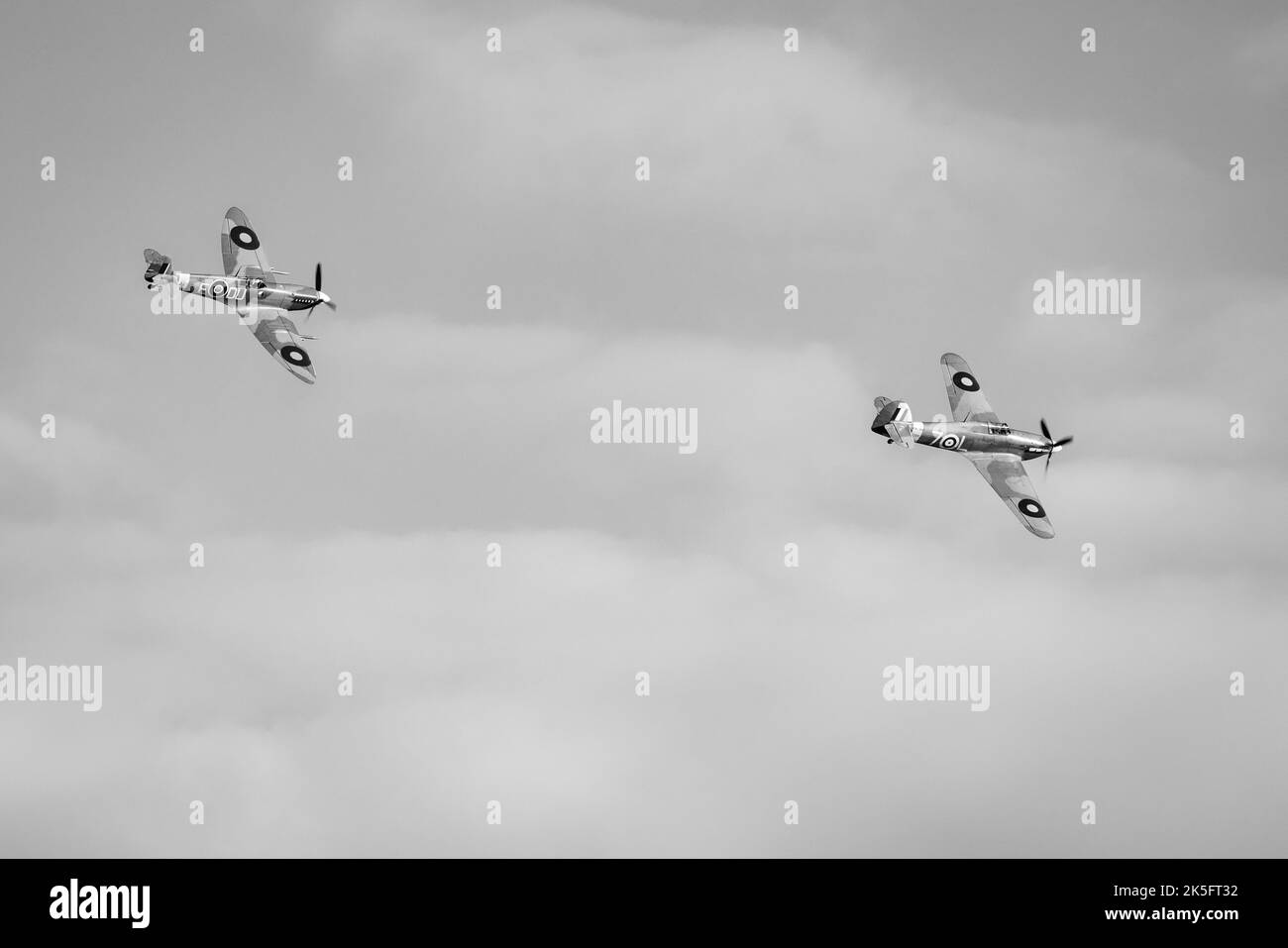 Supermarine Spitfire 'AR501' & Hawker Sea Hurricane “Z7015” flying in formation at the Race Day Airshow held at Shuttleworth on the 2nd October 2022 Stock Photo