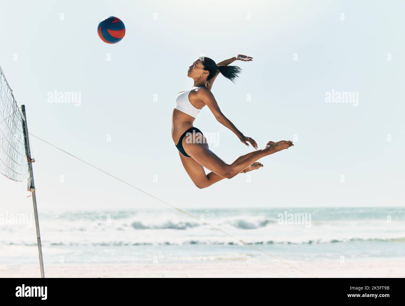 Sports woman jump at volleyball beach summer outdoor competition game
