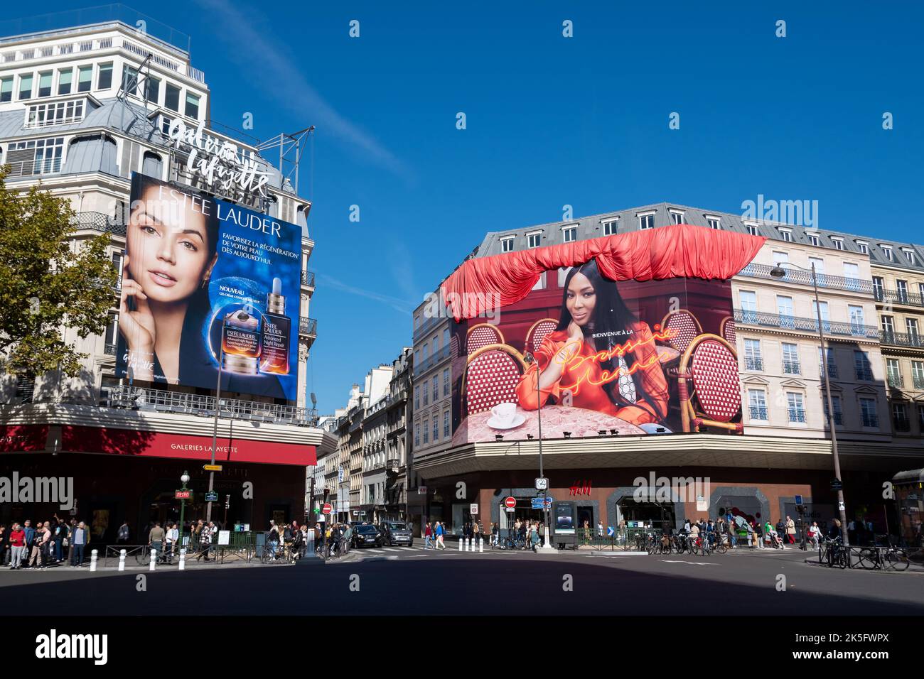 Advertising in Paris, France: Estée Lauder billboard on the Galeries Lafayette building and Brasserie Hennes giant ad on the H&M building Stock Photo