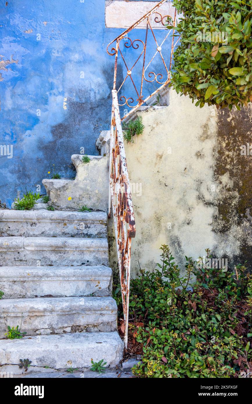 set of vintage steps or stairs rusted in pastel colours shabby chic design on greek building Stock Photo