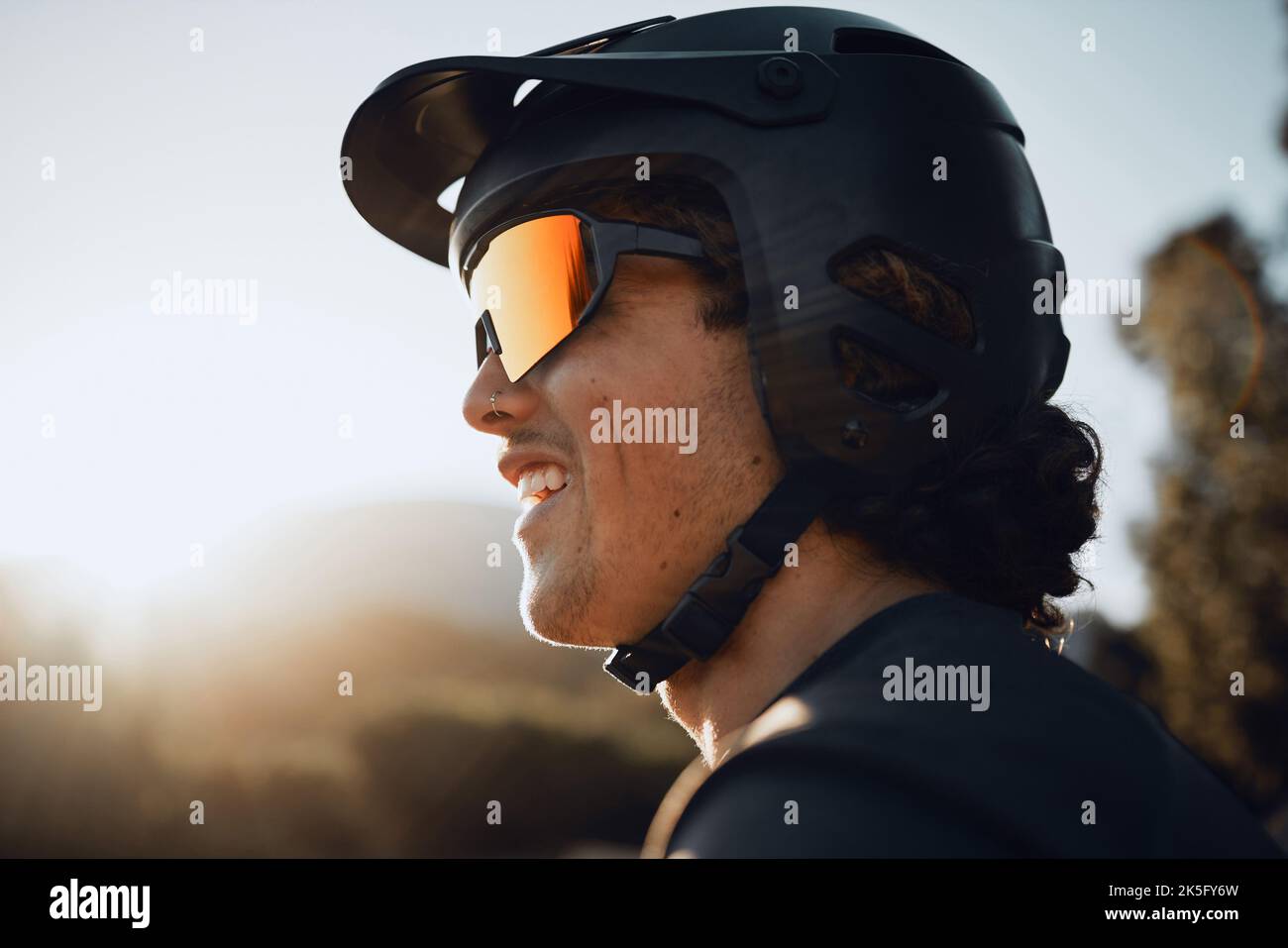 Safety, gear and motorcycle man with helmet and sunglasses in nature forest for outdoor adventure, travel or training with sky sunshine mockup Stock Photo