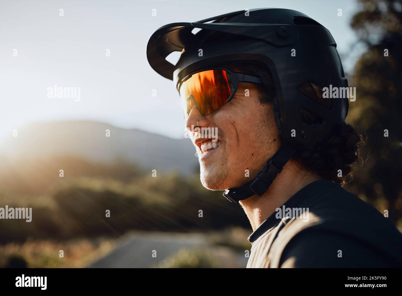 Mountain biking, glasses and helmet for man on adventure in nature for