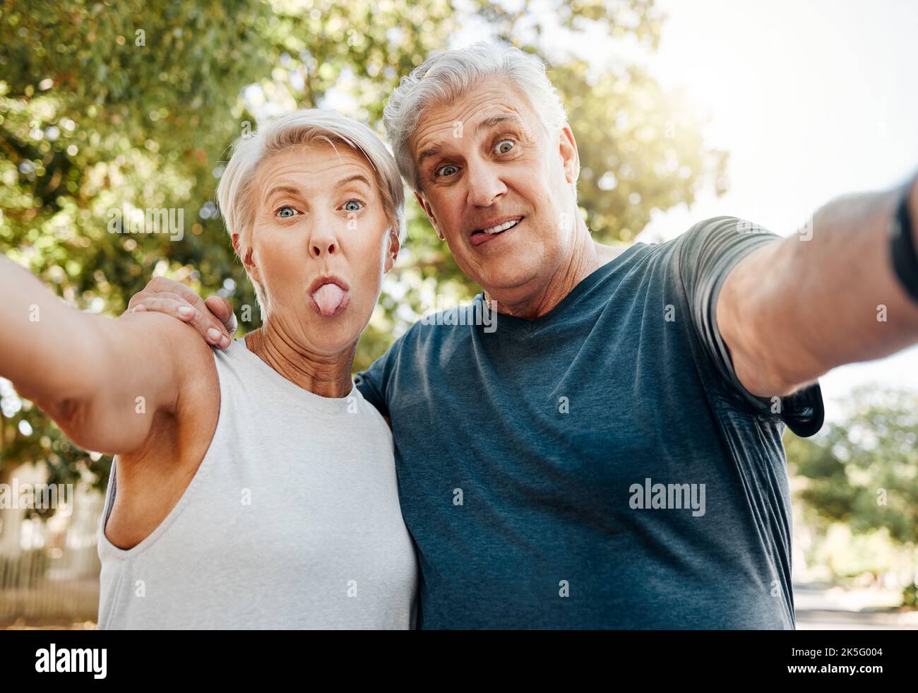 Fitness senior couple with selfie and outdoor hiking, exercise or workout together for healthy, wellness or retirement lifestyle. Crazy, adventure Stock Photo