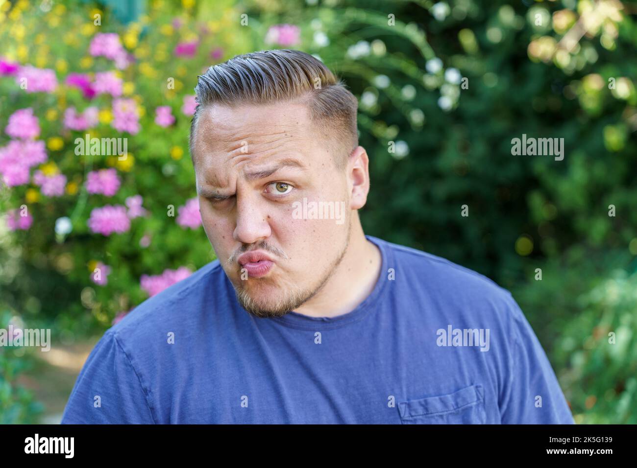 Young man showing total disbelief and scepticism as he raises an ...