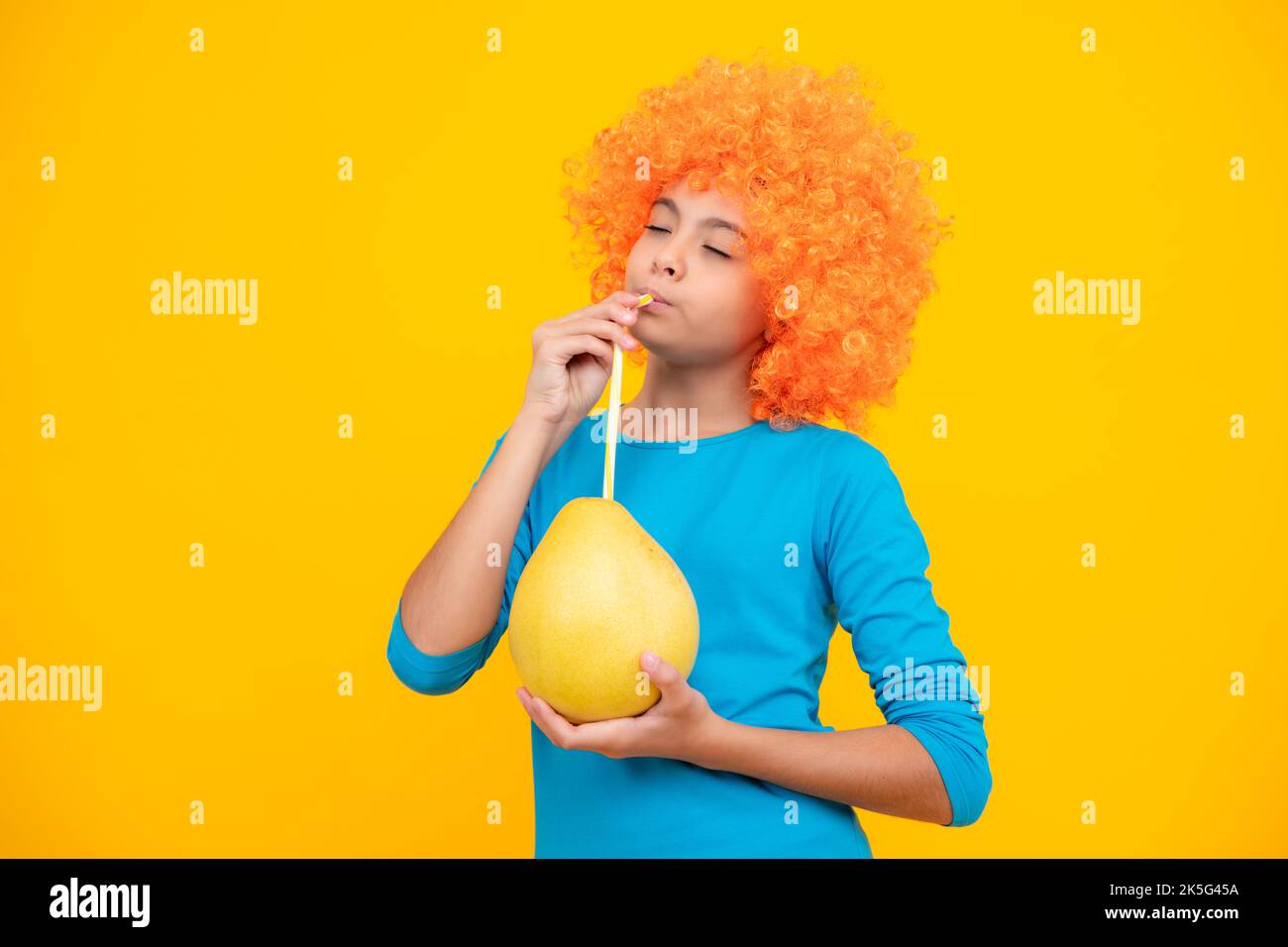 Summer fruits. Teenager child girl hold citrus fruit pummelo or pomelo