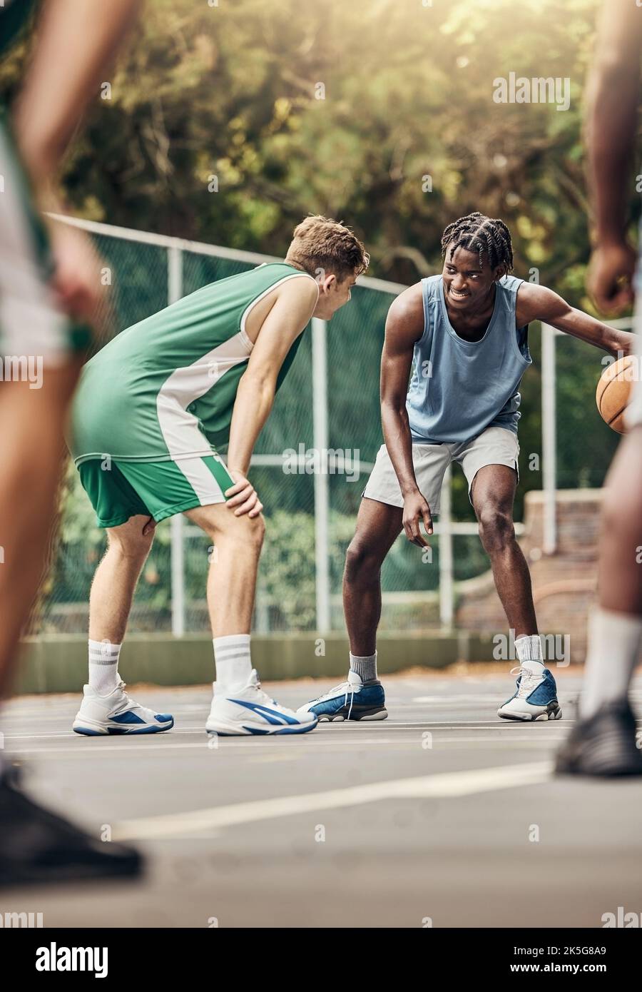 Men play basketball, team training exercise and sports match. Outdoor basketball court for a group exercise, fitness and workout for competition win Stock Photo