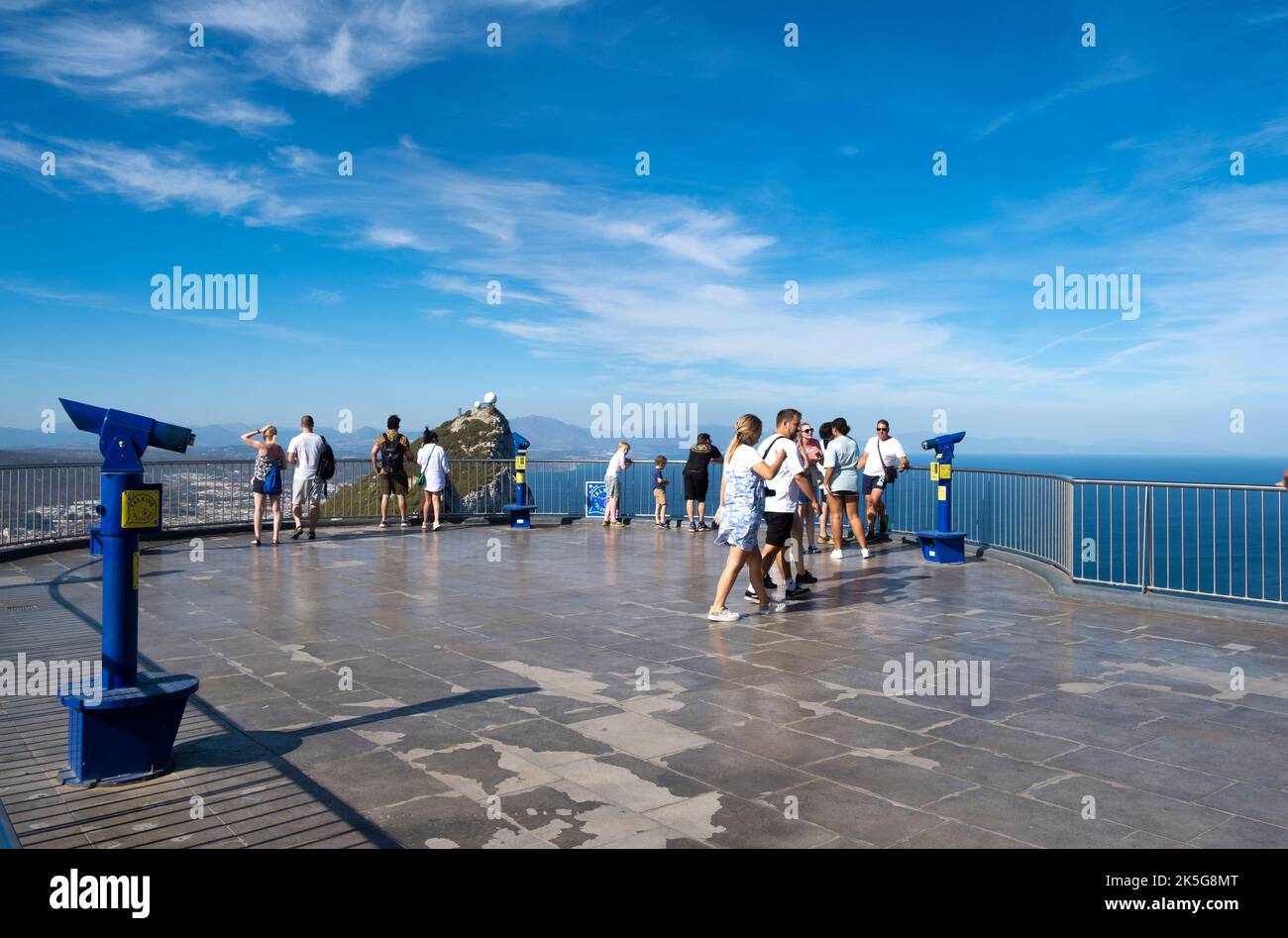 Tourists on the viewing platform at the Cable Car top station, which is located on the Upper Rock Nature Reserve at Gibraltar. Stock Photo