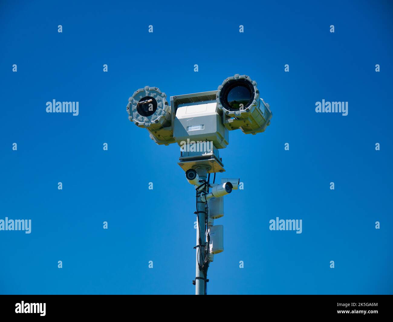 Remote controlled mobile surveillance cameras at the top of a tall mast