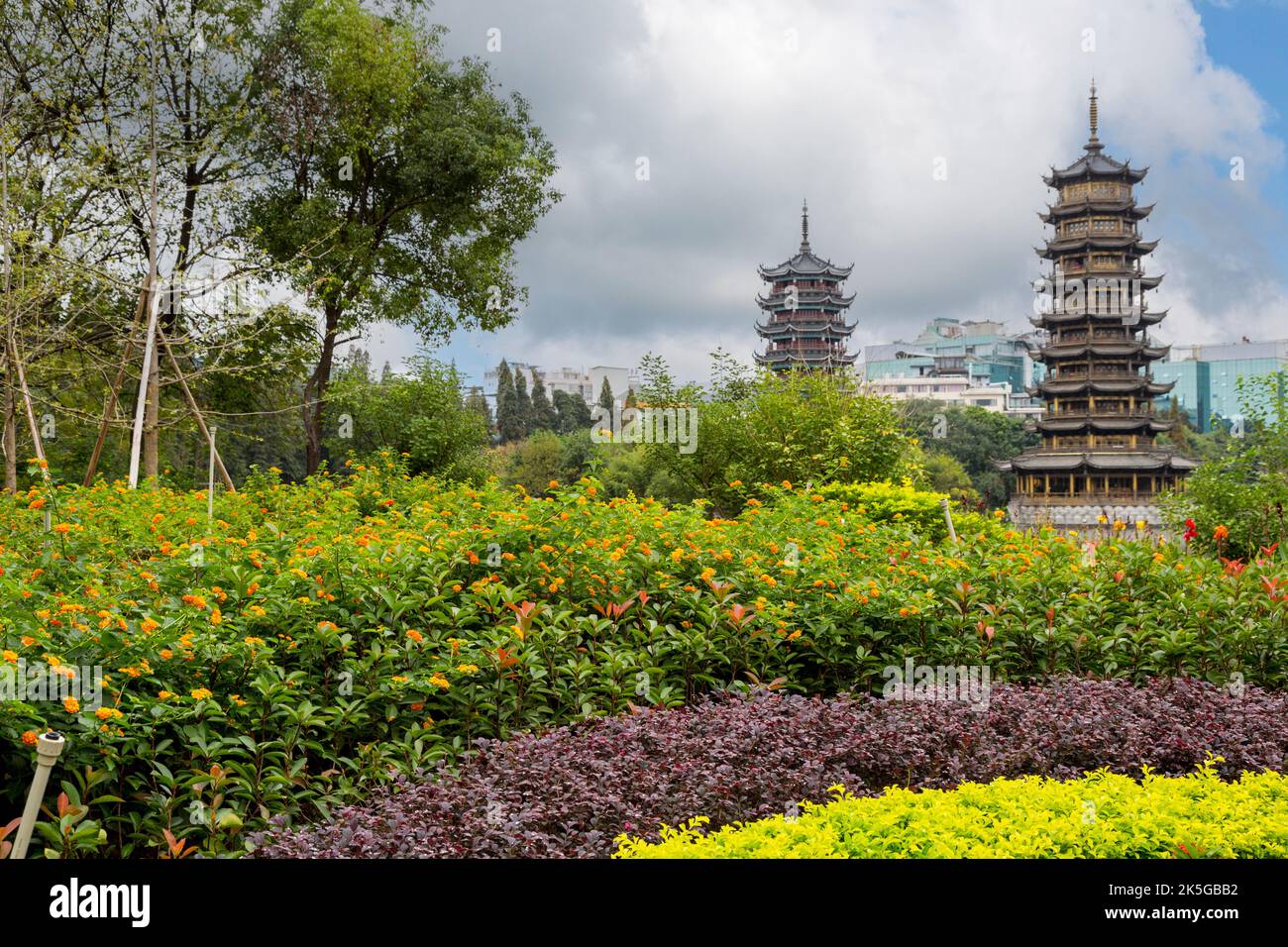 Guilin, China.  Sun and Moon Pagodas beside Fir Lake and Gardens. Stock Photo