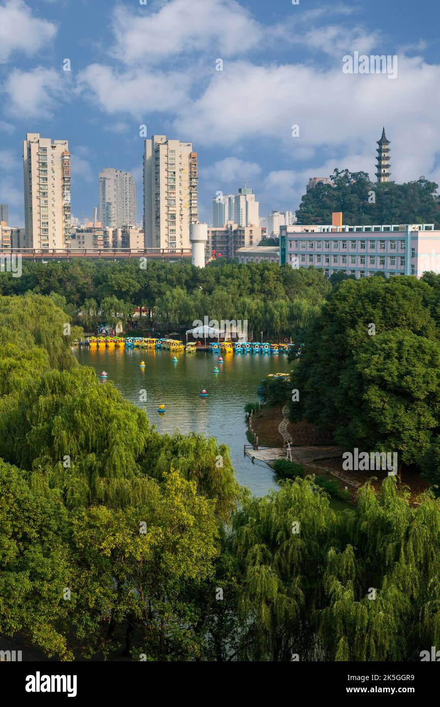 Wenzhou, Zhejiang, China.  Apartment Buildings in Background, Recreational Boats on Lake in Foreground. Stock Photo