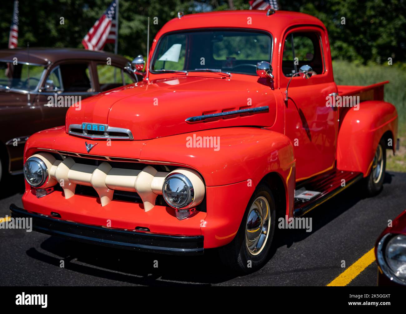 NISSWA, MN â€“ 30 JUL 2022: Bright red restored antique Ford F1 pickup truck at a car show on a sunny day. Stock Photo