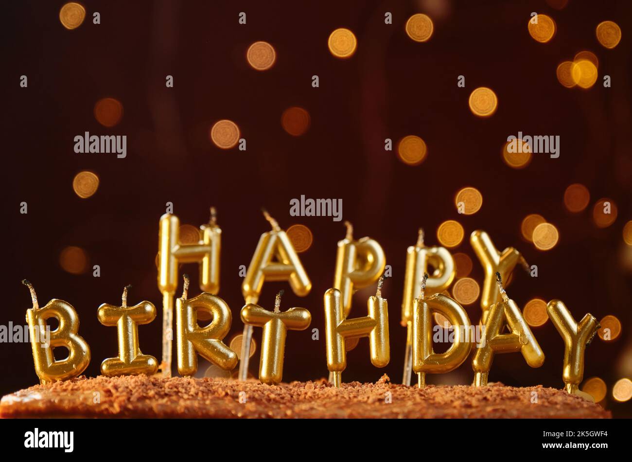 Birthday celebration concept. Minimalistic background with golden candles without fire letters