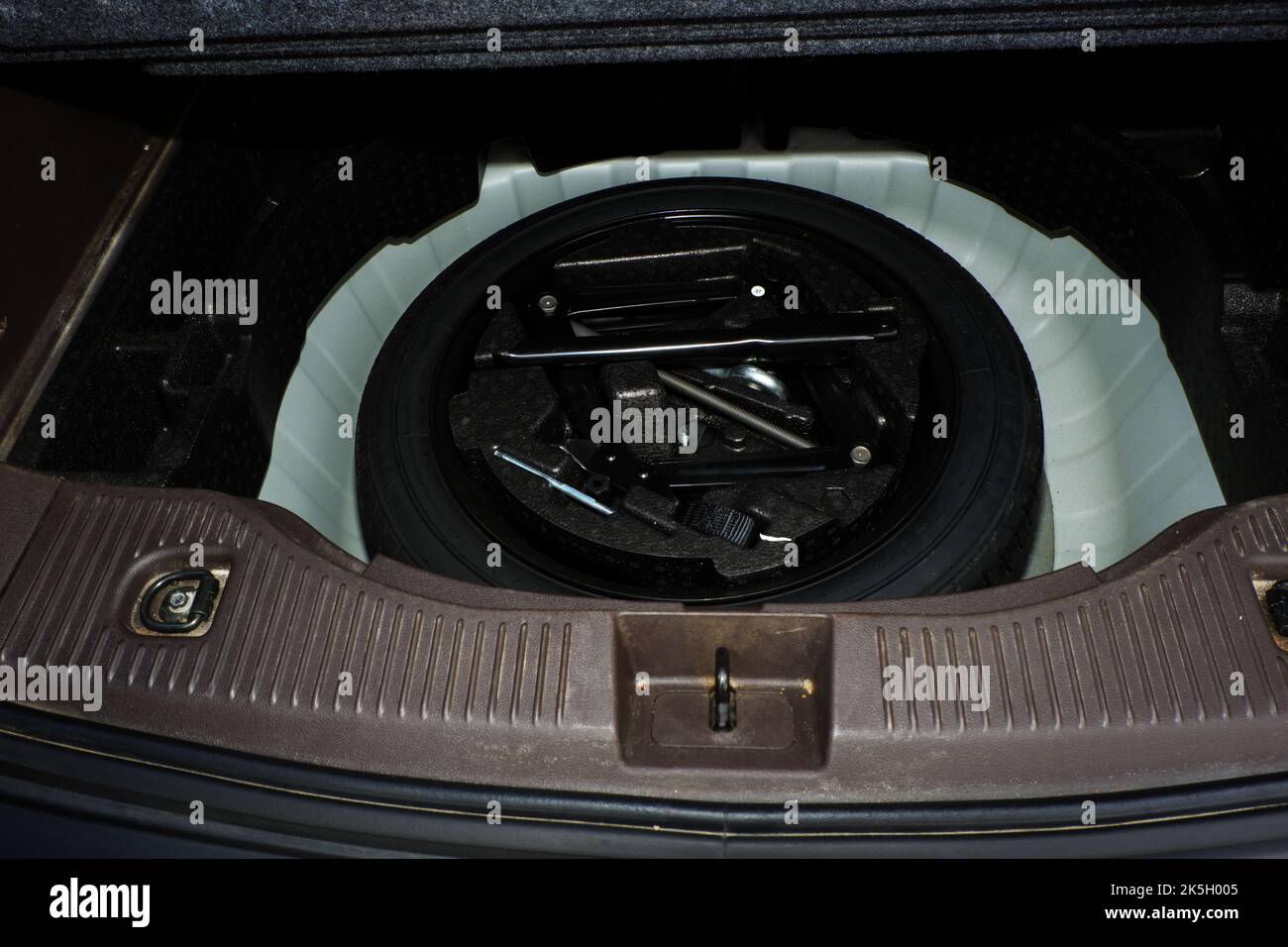 Spare Tyre and toolkit at the back of a luxury SUV car Stock Photo Alamy