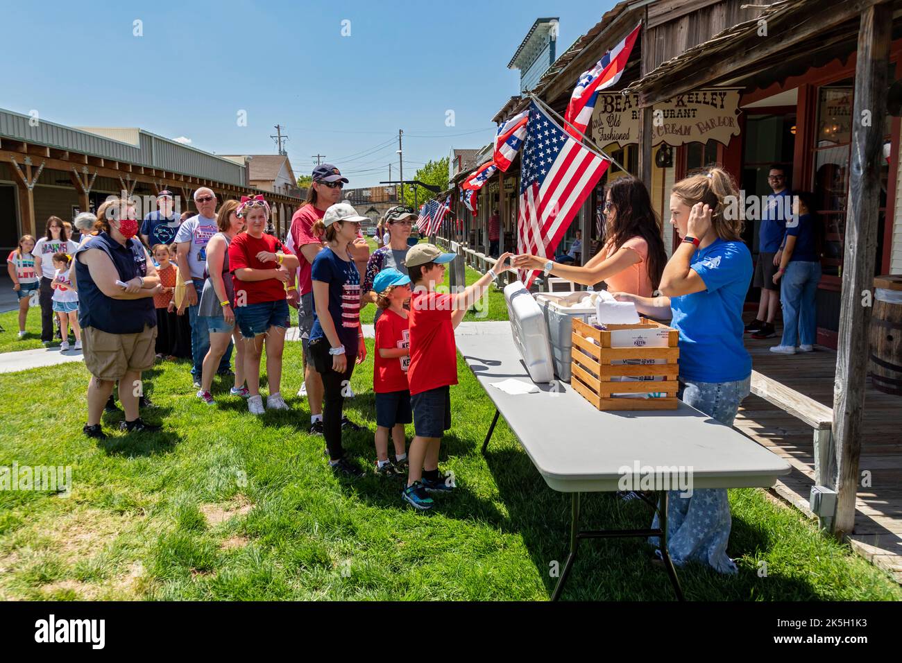 Dodge City, Kansas - People line up for a July 4th ice cream social at Boot Hill Museum. The museum preserves the history and culture of the old west. Stock Photo