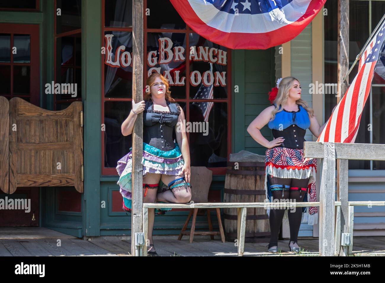 Dodge City, Kansas - Can Can Danders outside the Long Branch Saloon at Boot Hill Museum. The museum preserves the history and culture of the old west. Stock Photo