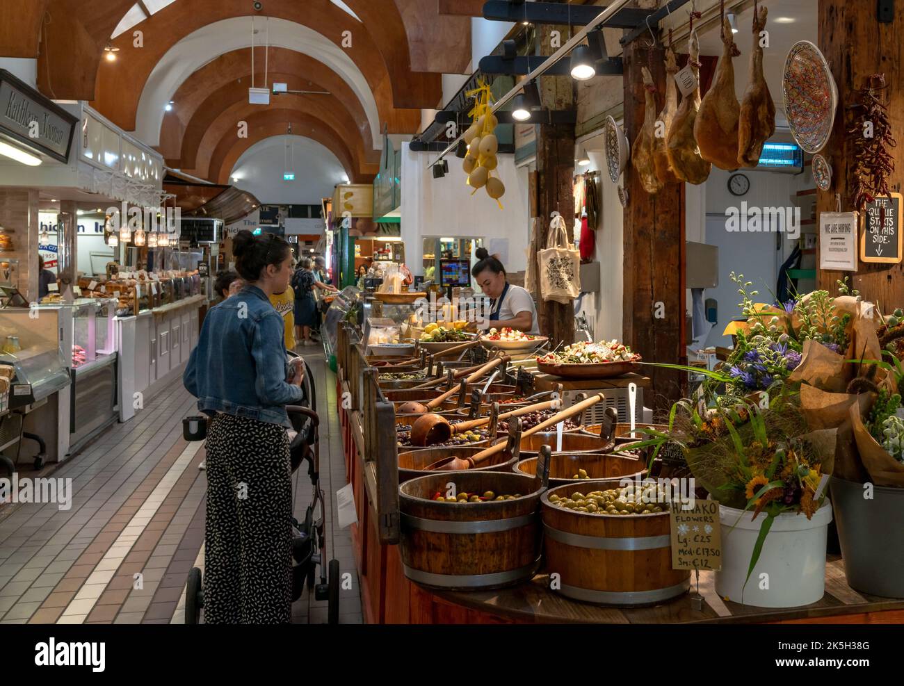 Cork, Ireland 16 August, 2022 customers buying food at a market stall with Spanish delicacies