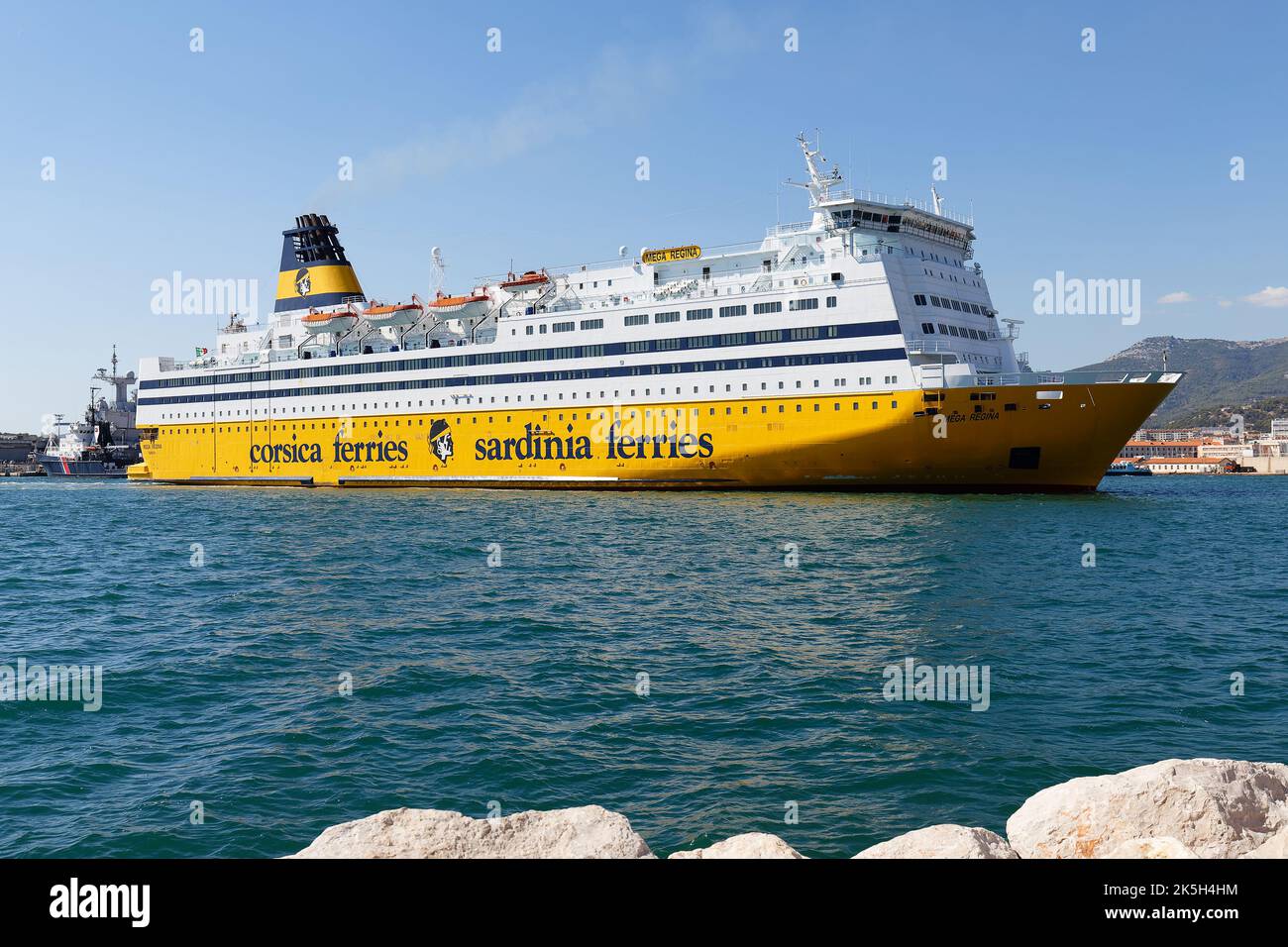 A yellow ferry from the company Corsica ferries in the port of Toulon